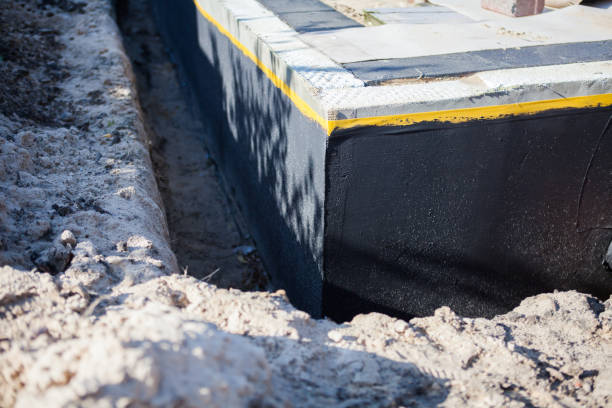 Professional Waterproofing technician working in Clairfield, TN
